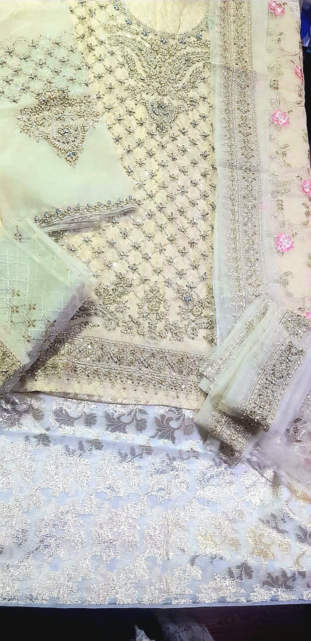 Unstitched Maria B Bridal dress in ivory gold color. - Image 2